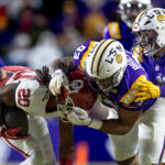 Oklahoma and LSU play football.