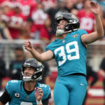 Cam Little kicks a field goal.