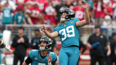 Cam Little kicks a field goal.