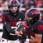 Texas Tech QB Behren Morton hands off.