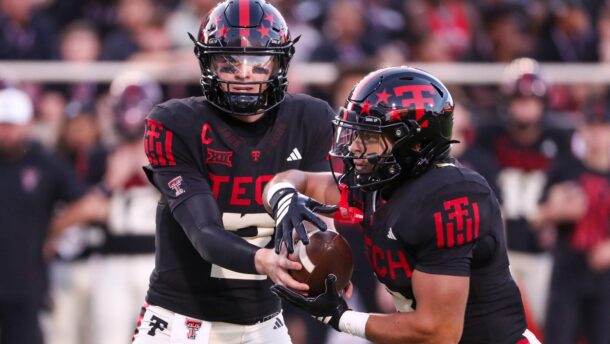 Texas Tech QB Behren Morton hands off.