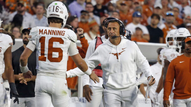 Texas coach Steve Sarkisian celebrates with QB Arch Manning.