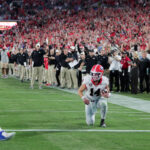 Gunner Stockton takes a knee.