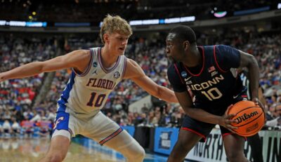 Florida's Thomas Haugh defends a UConn player.