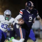 Jared Curtis runs with the ball.