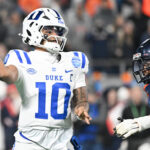 Darian Mensah plays against Virginia.