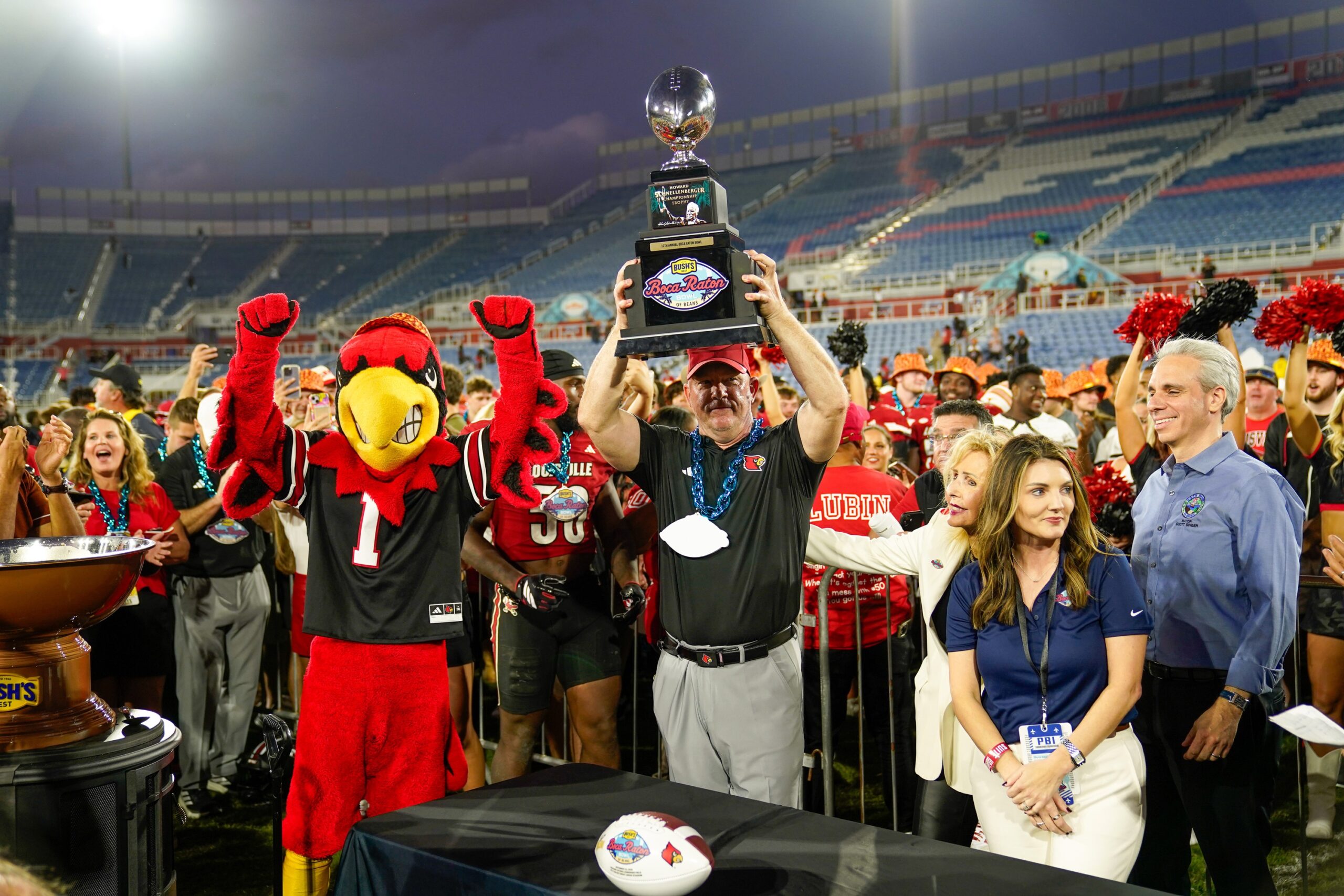 Louisville celebrates Boca Raton Bowl win with baked bean-filled trophy