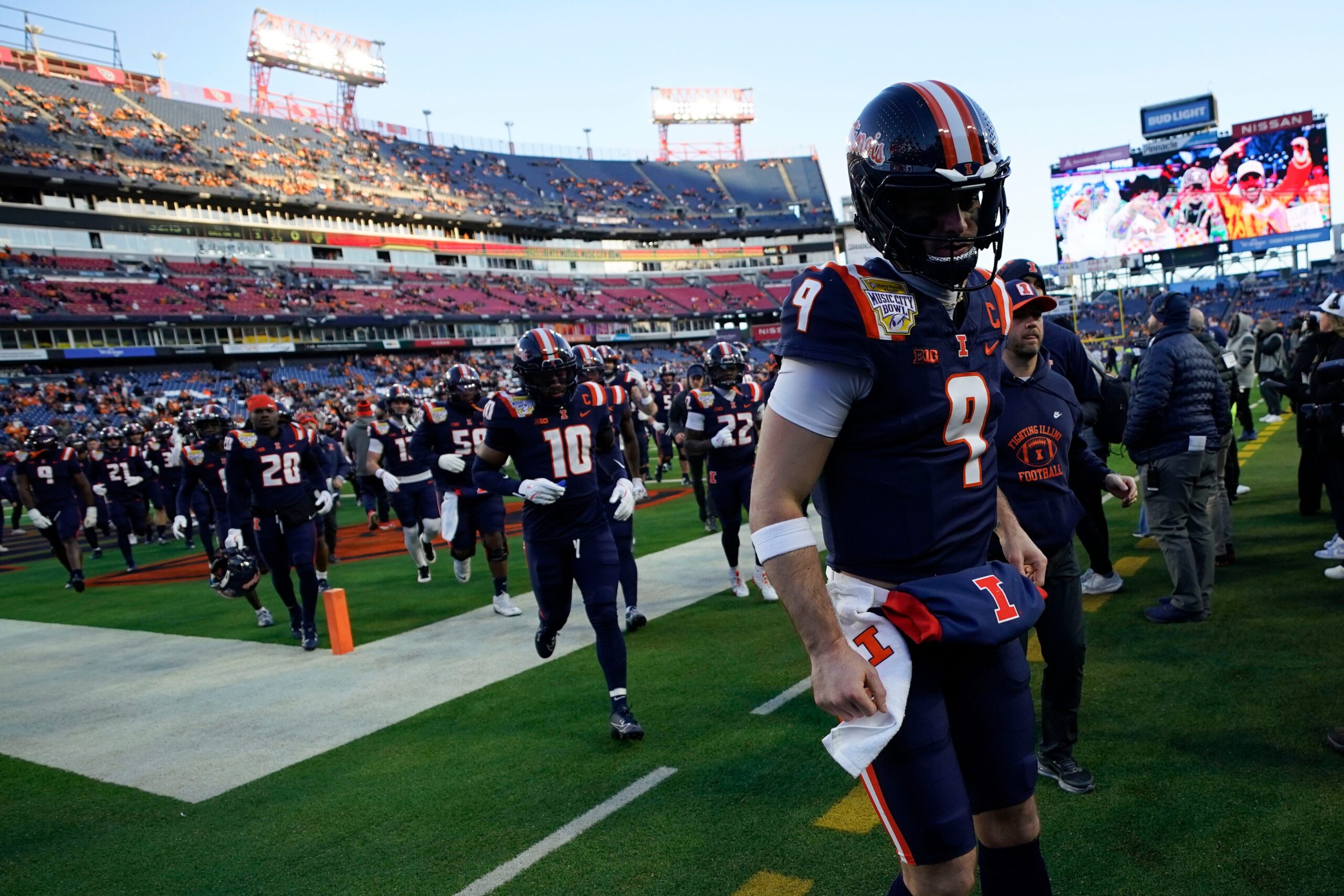 Luke Altmeyer trucks referee during Music City Bowl vs. Tennessee