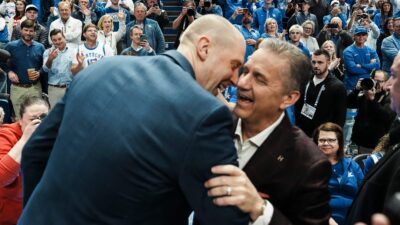 Mark Pope and John Calipari.