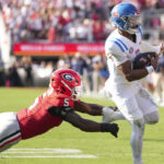 Trinidad Chambliss runs the ball against Georgia.