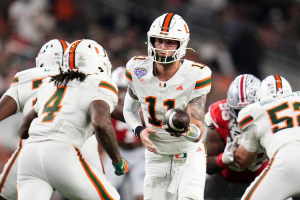 Miami QB Carson Beck hands to RB Mark Fletcher Jr.