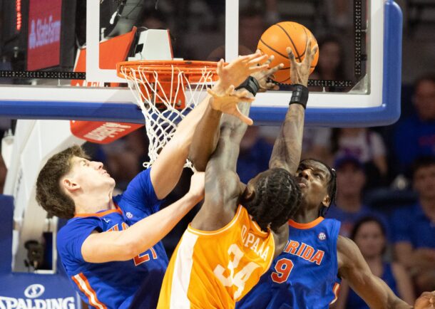 Rueben Chinyelu and Alex Condon block a shot by Felix Okpara.