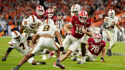 Fernando Mendoza scores a touchdown.