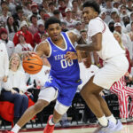 Otega Oweh dribbles.