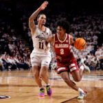 Aden Holloway drives the ball.