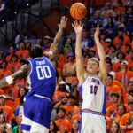 Florida's Thomas Haugh shoots the ball over Kentucky's Otega Oweh.