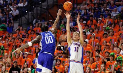 Florida's Thomas Haugh shoots the ball over Kentucky's Otega Oweh.