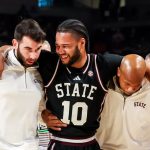 Jayden Epps being helped off the court.