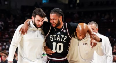 Jayden Epps being helped off the court.