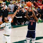 Arizona Wildcats guard Jaden Bradley scores a basket against Baylor Bears center Caden Powell