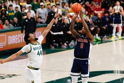 Arizona Wildcats guard Jaden Bradley scores a basket against Baylor Bears center Caden Powell