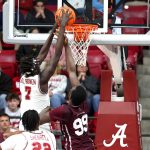 Alabama Crimson Tide forward Taylor Bol Bowen shoots against Mississippi State Bulldogs forward Achor Achor