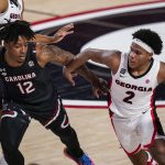 Sahvir Wheeler dribbles against South Carolina guard Trae Hannibal