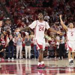 Billy Richmond III and guard Darius Acuff Jr celebrate after a play against the Texas Longhorns