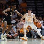 Ak Okereke defends Tennessee Volunteers forward J.P. Estrella
