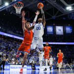 Otega Oweh attempts a layup against Florida Gators center Micah Handlogten