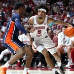 Amari Allen and Kevin Overton in the Alabama vs. Auburn basketball game.