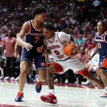 Labaron Philon drives to the basket against Auburn Tigers forward Keyshawn Hall.