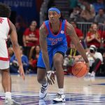 Jaron Pierre Jr. dribbles during the second half against the Louisville Cardinals.