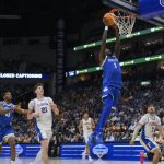 Denzel Aberdeen (1) dunks the ball against the Florida Gators.