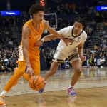 Nate Ament drives to the basket past Vanderbilt Commodores guard Chandler Bing.