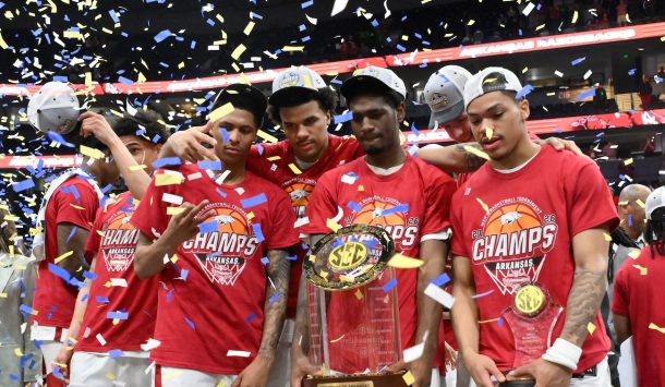 Arkansas players celebrate their SEC Tournament title.