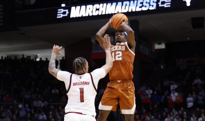 Tramon Mark of Texas shoots over an NC State defender.