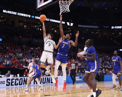 Vanderbilt Commodores guard Tyler Tanner drives to the hoop past McNeese Cowboys forward Jerrell Colbert.