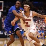 Amari Allen drives against Hofstra Pride guard Cruz Davis