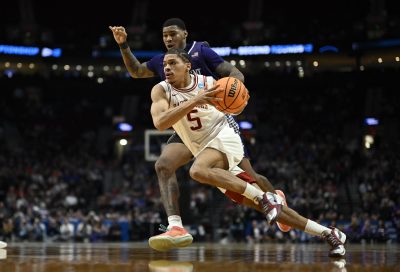 Mar 21, 2026; Portland, OR, USA; Arkansas Darius Acuff Jr. drives against High Point Panthers forward Cam'ron Fletcher.