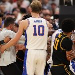 Florida and Iowa players scuffle.