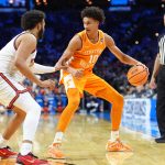 Tennessee Volunteers forward Nate Ament dribbles the ball against the Virginia Cavaliers.