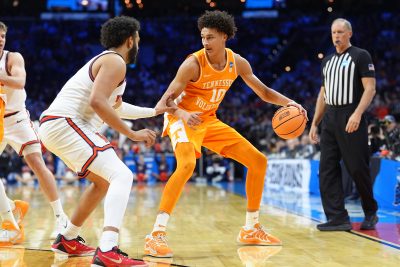 Tennessee Volunteers forward Nate Ament dribbles the ball against the Virginia Cavaliers.