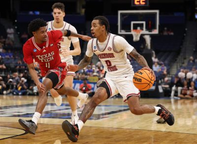 Alabama Crimson Tide guard Labaron Philon dribbles the ball against Texas Tech Red Raiders guard Jaylen Petty.