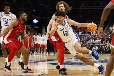 Duke Blue Devils forward Cameron Boozer dribbles the ball past St. John's Red Storm forward Ruben Prey.
