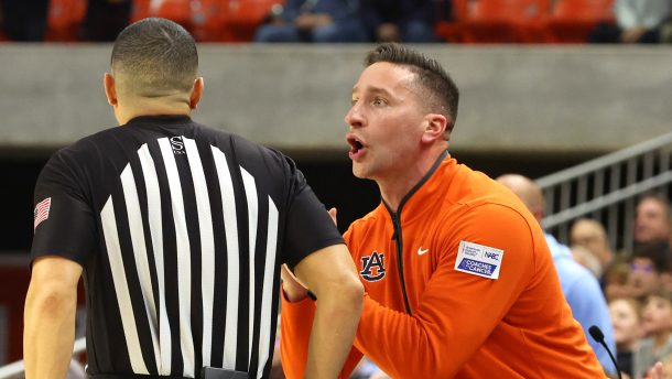 Auburn coach Steven Pearl talks to an official.