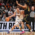 Illinois Fighting Illini forward David Mirkovic (0) controls the ball against Iowa Hawkeyes guard Kael Combs.