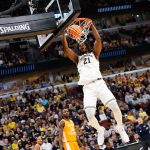 Michigan Wolverines forward Morez Johnson Jr. dunks the ball in the second half against the Tennessee Volunteers.