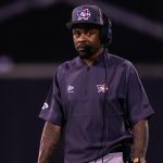 Ted Ginn coaches during a game.