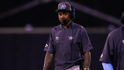 Ted Ginn coaches during a game.